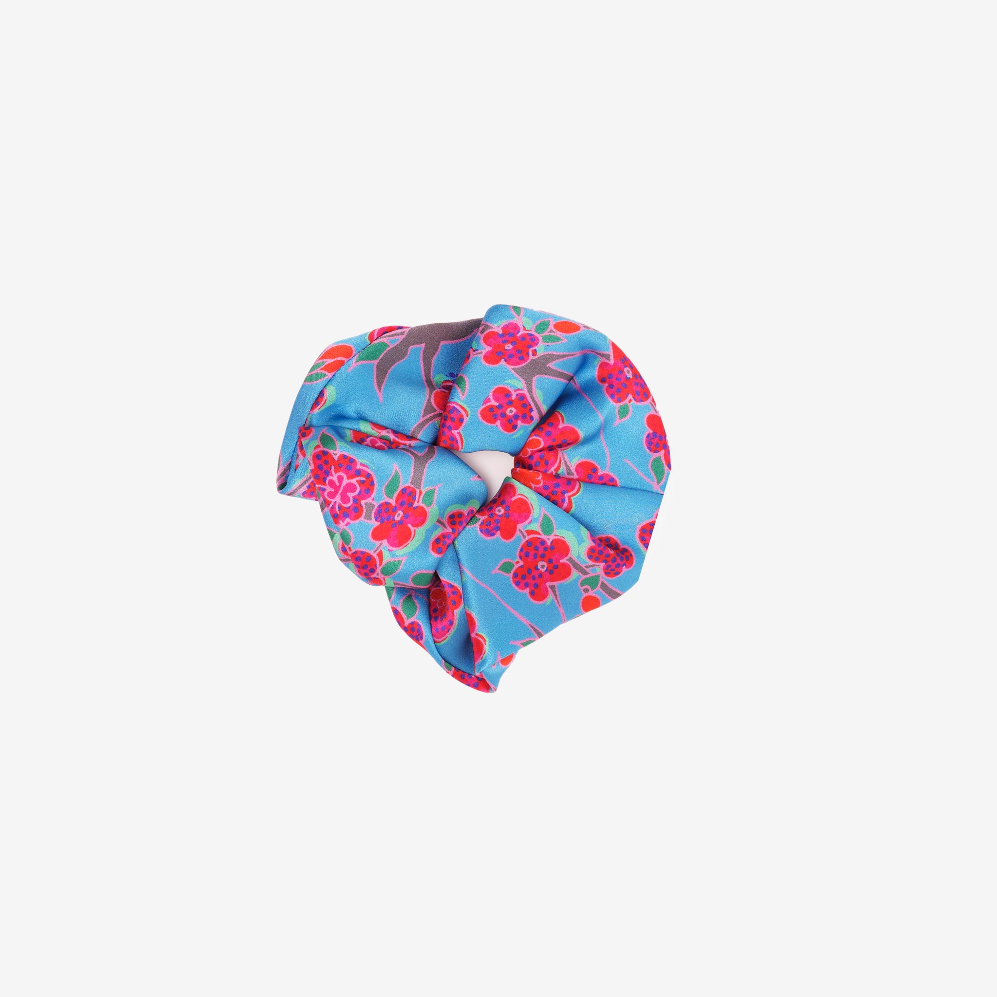 Crimson Rose scrunchie featuring hand drawn flower print from the Island Dreams collection in blue, red, pink, grey and green.