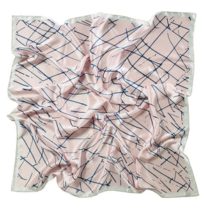 Large Crimson Rose scarf features a navy blue scribble print on a dusty pink base.